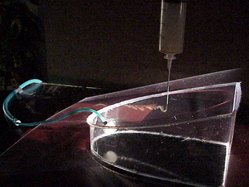 Cigarette smoke deflected above a CO₂-filled simulated surgical cavity